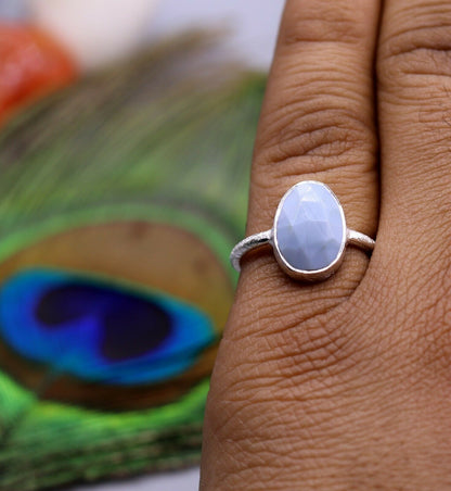 Handmade sterling silver unisex anniversary ring with a vibrant stone, crafted by TRIBAL ORNAMENTS.