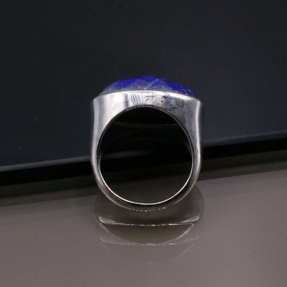 Unisex silver ring with a simulated sapphire stone, crafted from 925 solid silver, featuring Indian jewelry design elements.