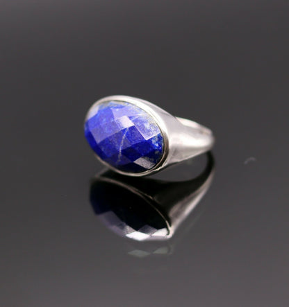 Unisex sterling silver ring with simulated sapphire stone, featuring detailed Indian jewelry design by Tribal Ornaments.