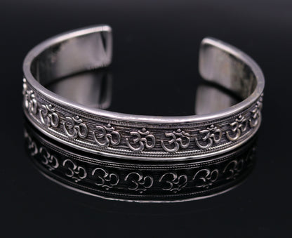 Handcrafted 925 sterling silver or gold polished 'AUM' mantra bangle bracelet, adjustable unisex ethnic jewelry with intricate detailing.