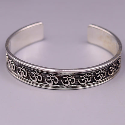 Sterling silver or gold polished handcrafted AUM mantra bangle bracelet, adjustable unisex ethnic jewelry from TRIBAL ORNAMENTS.