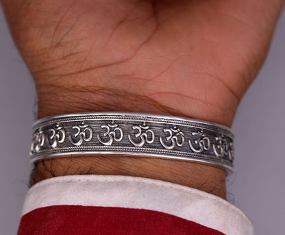 Handcrafted 925 sterling silver or gold polished 'AUM' mantra bangle bracelet, adjustable unisex ethnic jewelry from India.