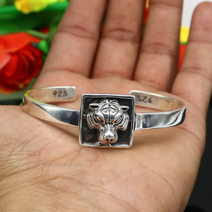 Sterling silver or gold polished handmade lion face bangle bracelet by TRIBAL ORNAMENTS, adjustable unisex jewelry from India.