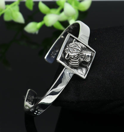 Sterling silver or gold polished handmade lion face bangle bracelet by TRIBAL ORNAMENTS, adjustable unisex jewelry from India.