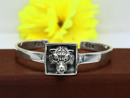 Sterling silver or gold handmade lion face design unisex bangle bracelet by TRIBAL ORNAMENTS, adjustable jewelry from India.