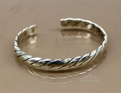 Sterling silver or gold polished handmade open face bangle bracelet with unique tribal design, adjustable cuff jewelry.
