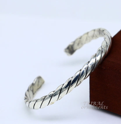 Sterling silver or gold polished handmade open face bangle bracelet with unique tribal design, adjustable cuff jewelry from TRIBAL ORNAMENTS.