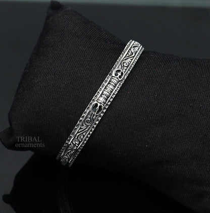 Handmade vintage-style silver and gold polished tribal bangle cuff bracelet with intricate design, unisex tribal jewelry.