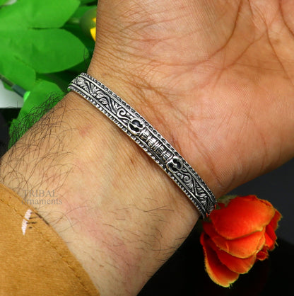 Sterling silver or gold polished vintage tribal bangle cuff bracelet with intricate handmade design, unisex jewelry by Tribal Ornaments.