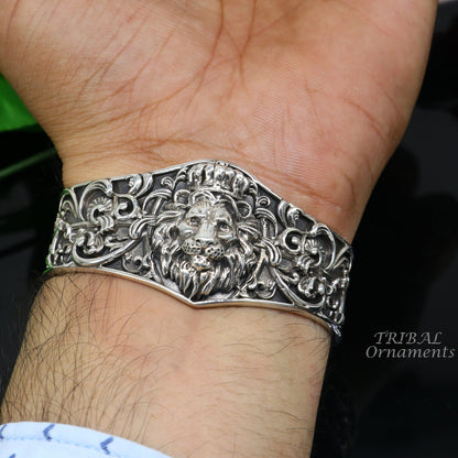 Sterling silver lion cuff bracelet by Tribal Ornaments, handmade with polished silver or gold finish, featuring intricate tribal design.