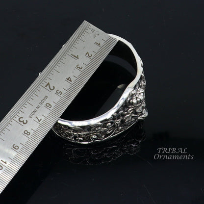 Sterling silver lion cuff bracelet by Tribal Ornaments, handmade with polished silver or gold finish, featuring a detailed lion design.