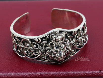 Tribal Ornaments lion cuff bracelet in 925 sterling silver, handmade with polished silver or gold finish, featuring a detailed lion design.