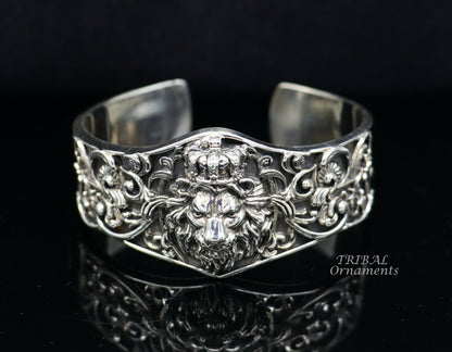 Handmade lion cuff bracelet in 925 sterling silver with polished finish, available in silver or gold, by TRIBAL ORNAMENTS.