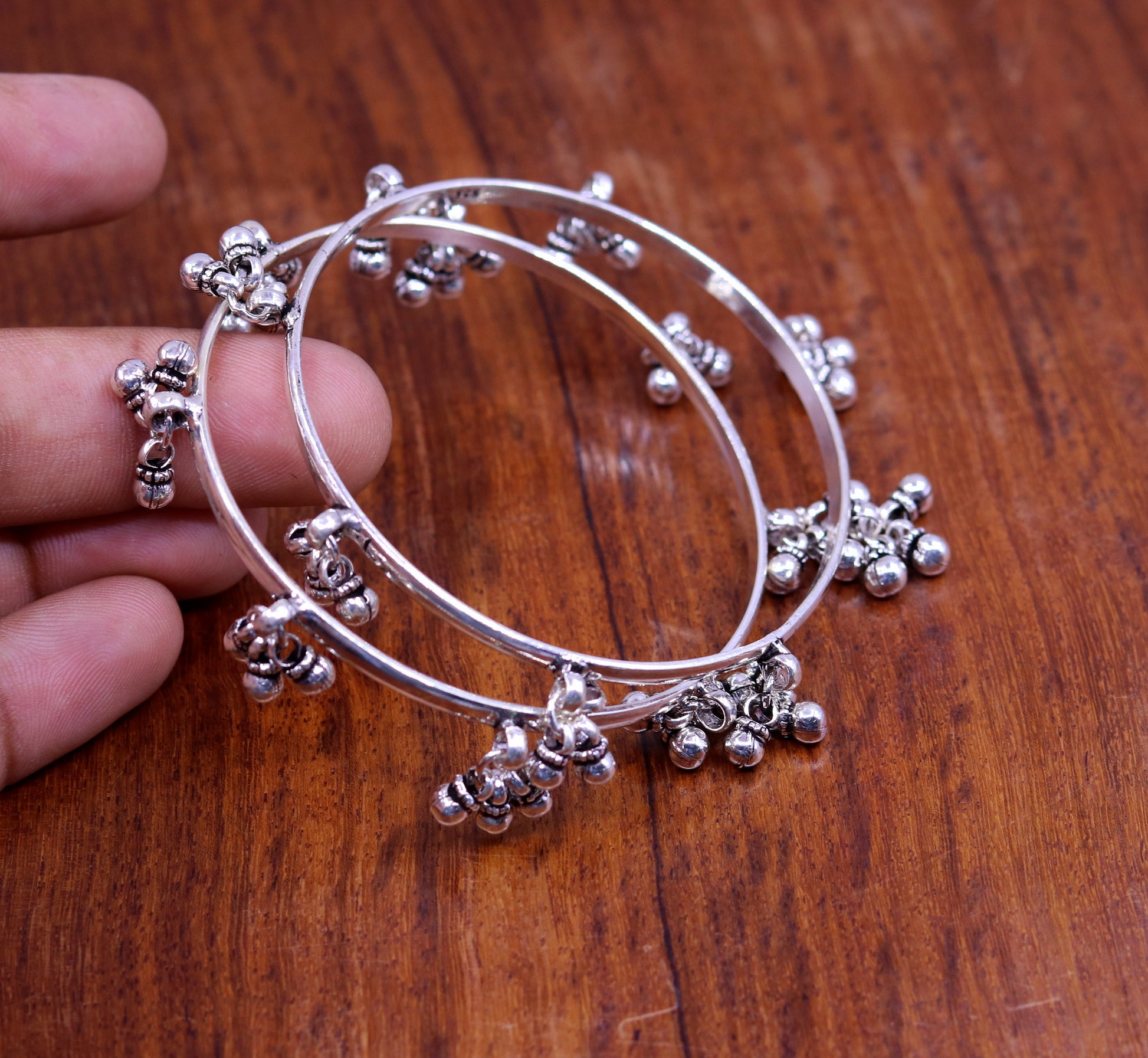 Sterling silver handmade charm bangle bracelet by TRIBAL ORNAMENTS featuring tribal-inspired designs, perfect for tribal belly dance jewelry.