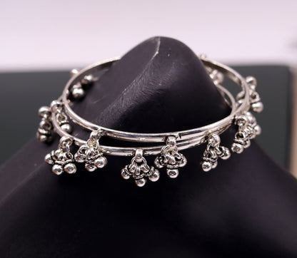 Sterling silver handmade tribal charm bangle bracelet with intricate design, perfect for tribal belly dance jewelry and gifting.