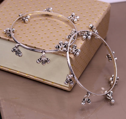 Sterling silver handmade charm bangle bracelet with tribal design, perfect for belly dance jewelry and gifting.