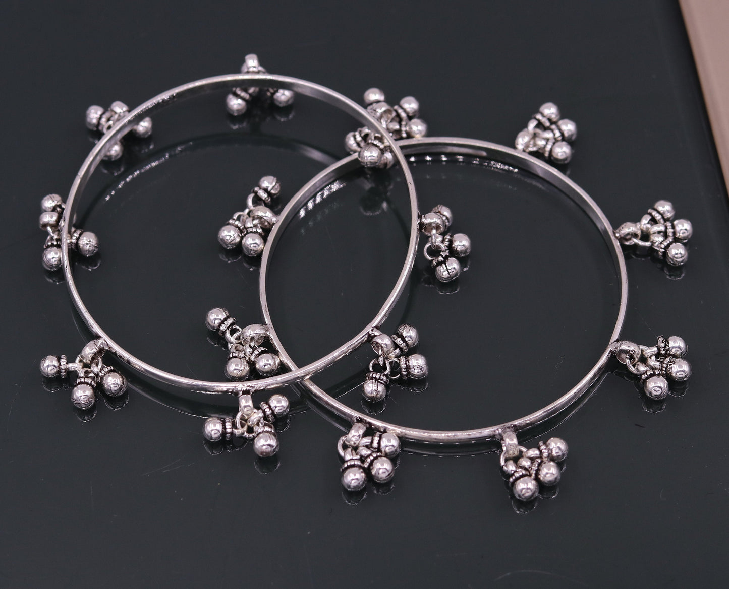 Sterling silver handmade charm bangle bracelet with tribal design, perfect for belly dance jewelry or gifting.