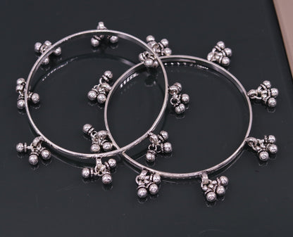 Sterling silver handmade charm bangle bracelet with tribal design, perfect for belly dance jewelry or gifting.