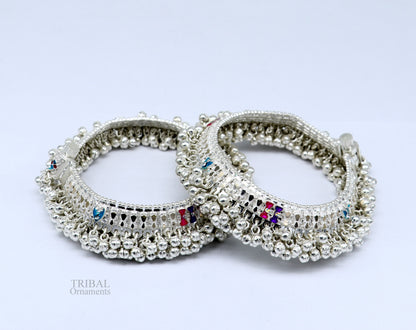 Solid silver anklet with jingling bells and tribal charm, perfect for belly dance and tribal jewelry enthusiasts.
