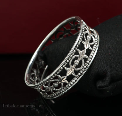 Sterling silver bangle bracelet with waved tiny ball design, customizable tribal jewelry, ideal for brides and ethnic gifting.