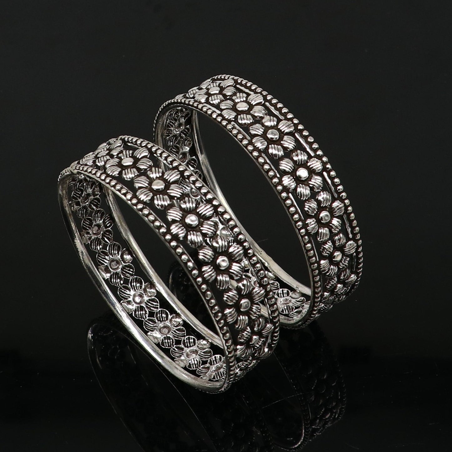 Sterling silver wide floral bangle bracelet by TRIBAL ORNAMENTS, featuring intricate floral design, perfect for ethnic bridal jewelry.