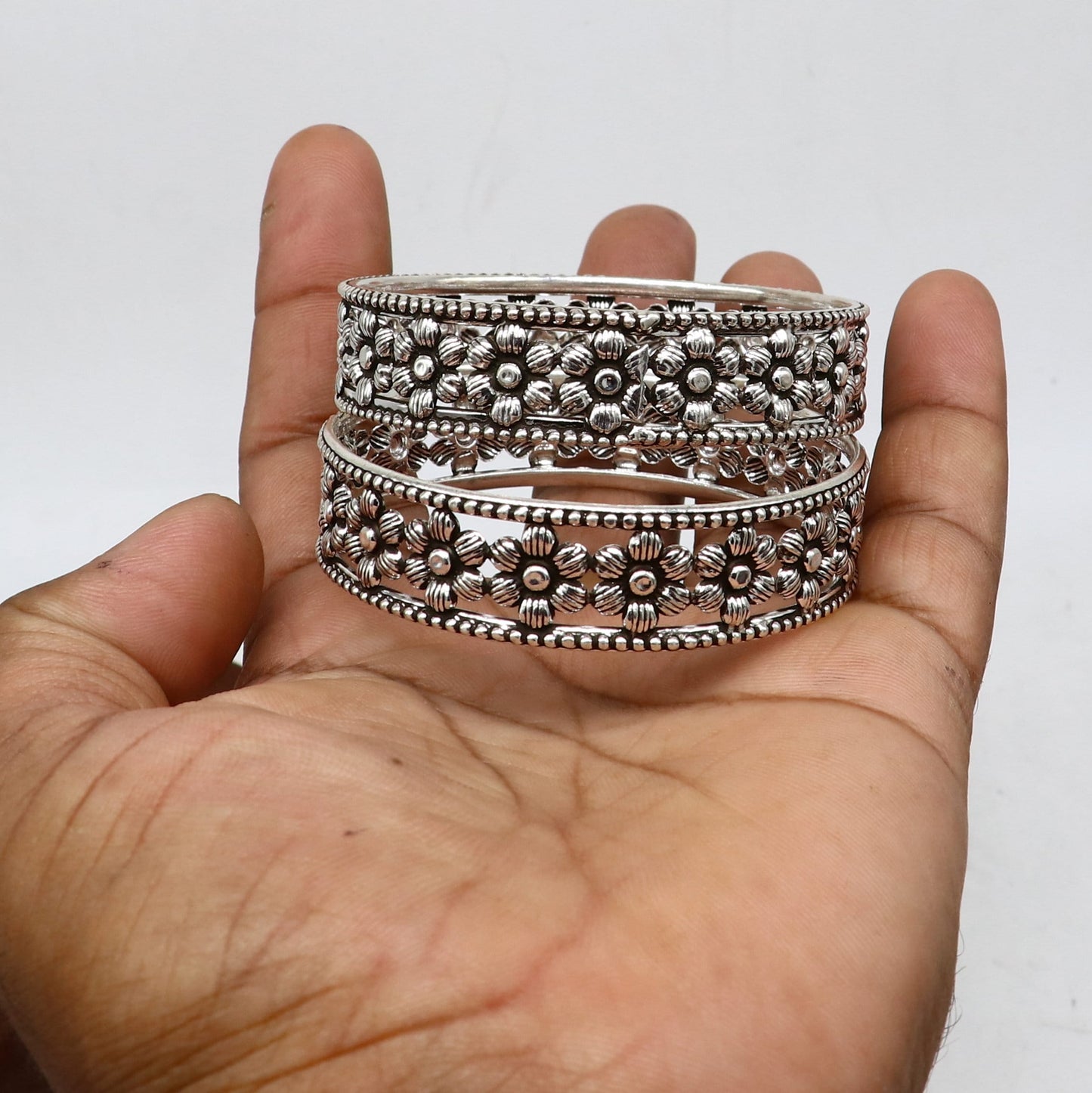 Sterling silver wide floral bangle bracelet by Tribal Ornaments, stylish ethnic jewelry perfect for brides and special occasions.