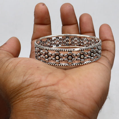 Sterling silver wide floral bangle bracelet by TRIBAL ORNAMENTS, stylish ethnic jewelry, perfect for brides and special occasions.
