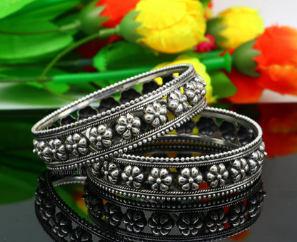 Sterling silver vintage floral bangle bracelet by TRIBAL ORNAMENTS featuring intricate tribal tribal ethnic jewelry design.