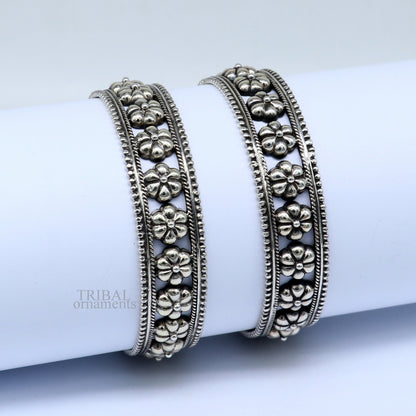 Vintage floral design 925 sterling silver bangle bracelet by TRIBAL ORNAMENTS featuring intricate tribal and ethnic jewelry details.