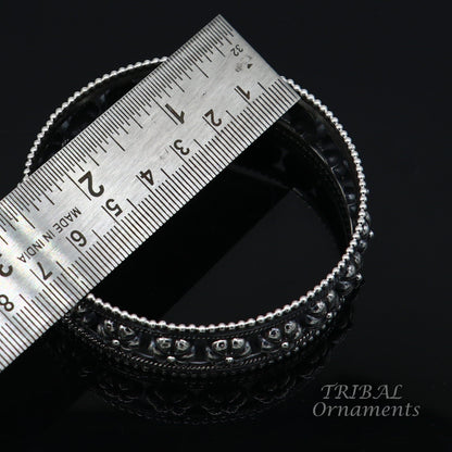Vintage floral design 925 sterling silver bangle bracelet by TRIBAL ORNAMENTS, featuring intricate tribal and ethnic handmade jewelry.