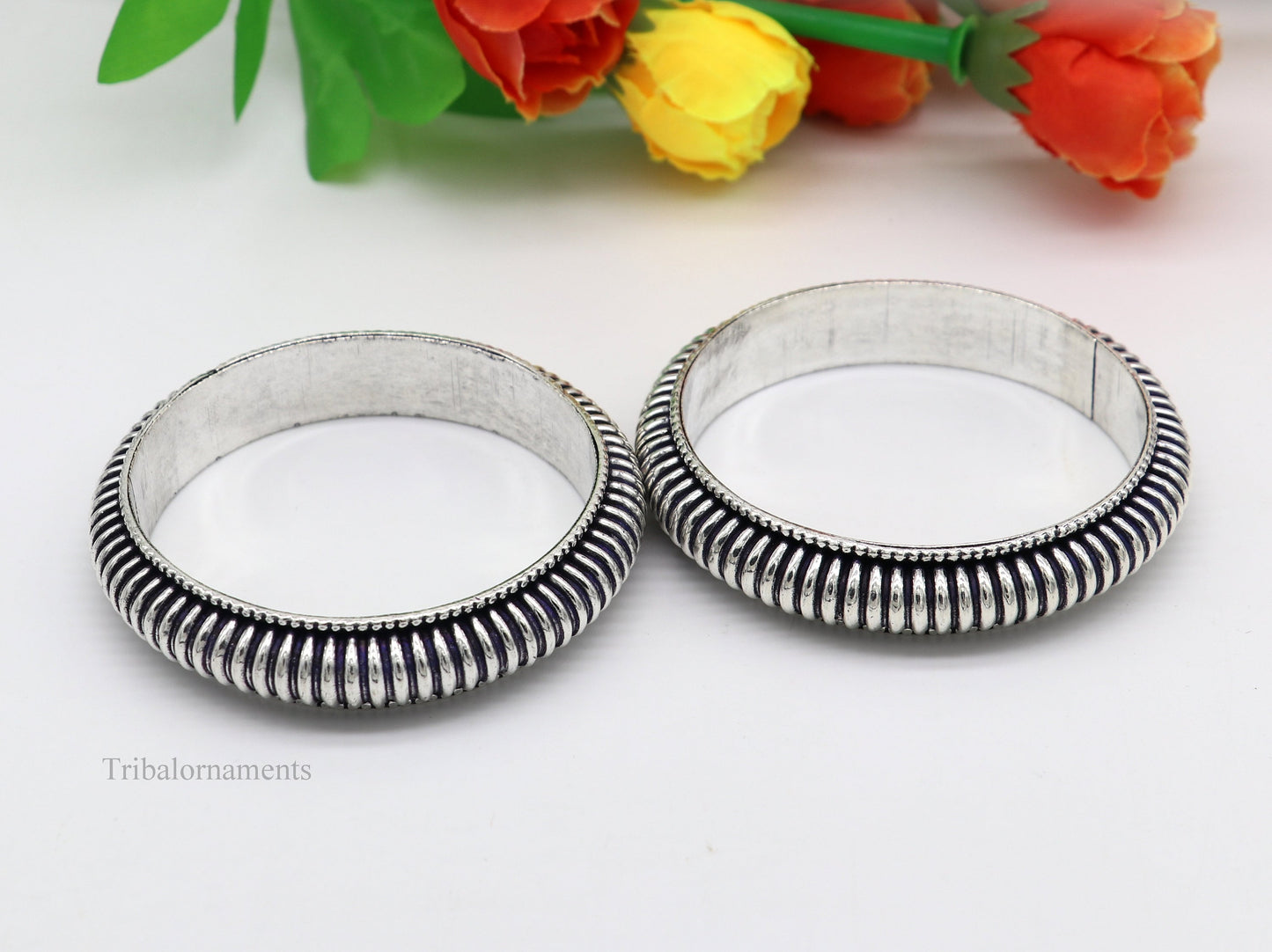 Sterling silver handmade Indian vintage bangle bracelet with intricate tribal design, stylish for brides and special occasions.