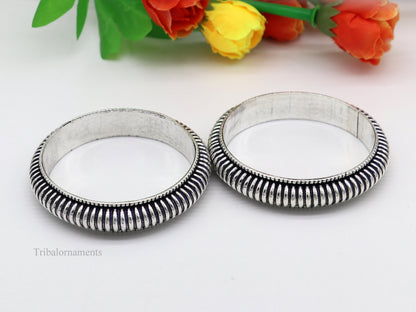 Sterling silver handmade Indian vintage bangle bracelet with intricate tribal design, stylish for brides and special occasions.