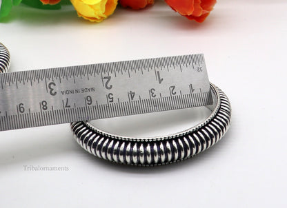 Handmade 925 sterling silver Indian traditional vintage bangle bracelet with intricate tribal design, stylish and suitable for bridal jewelry.