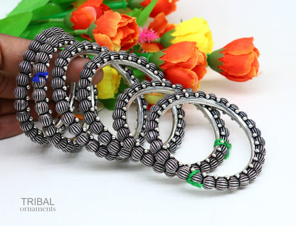 Sterling silver vintage tribal bangle bracelet by TRIBAL ORNAMENTS, featuring intricate Indian design and stylish handmade craftsmanship.
