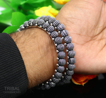 Sterling silver handmade Indian vintage bangle bracelet with tribal design, stylish and ethnic jewelry for brides or gifting.