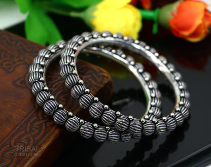 Sterling silver handmade Indian vintage bangle bracelet with tribal design, stylish and ethnic jewelry for brides and gifting.