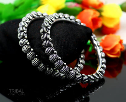 Sterling silver handmade Indian vintage bangle bracelet with tribal design, stylish ethnic jewelry for brides or gifting.
