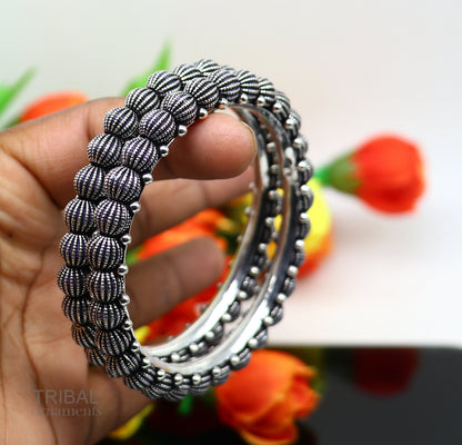 Sterling silver handmade Indian vintage bangle bracelet with tribal design, stylish ethnic jewelry for brides or gifting.