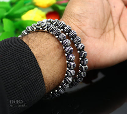 Sterling silver handmade Indian vintage bangle bracelet with tribal design, stylish ethnic jewelry for brides and gifting.