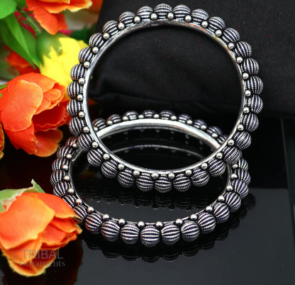 Sterling silver handmade Indian vintage bangle bracelet with tribal design, stylish ethnic jewelry for brides or gifting.