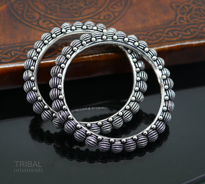 Sterling silver handmade Indian vintage bangle bracelet with tribal design, stylish ethnic jewelry for brides or gifting.