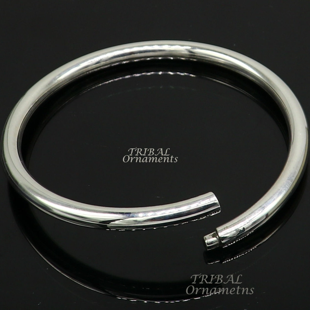 Shiny 925 sterling silver handmade bangle bracelet with a smooth, plain design, suitable for personalized unisex jewelry gifting.