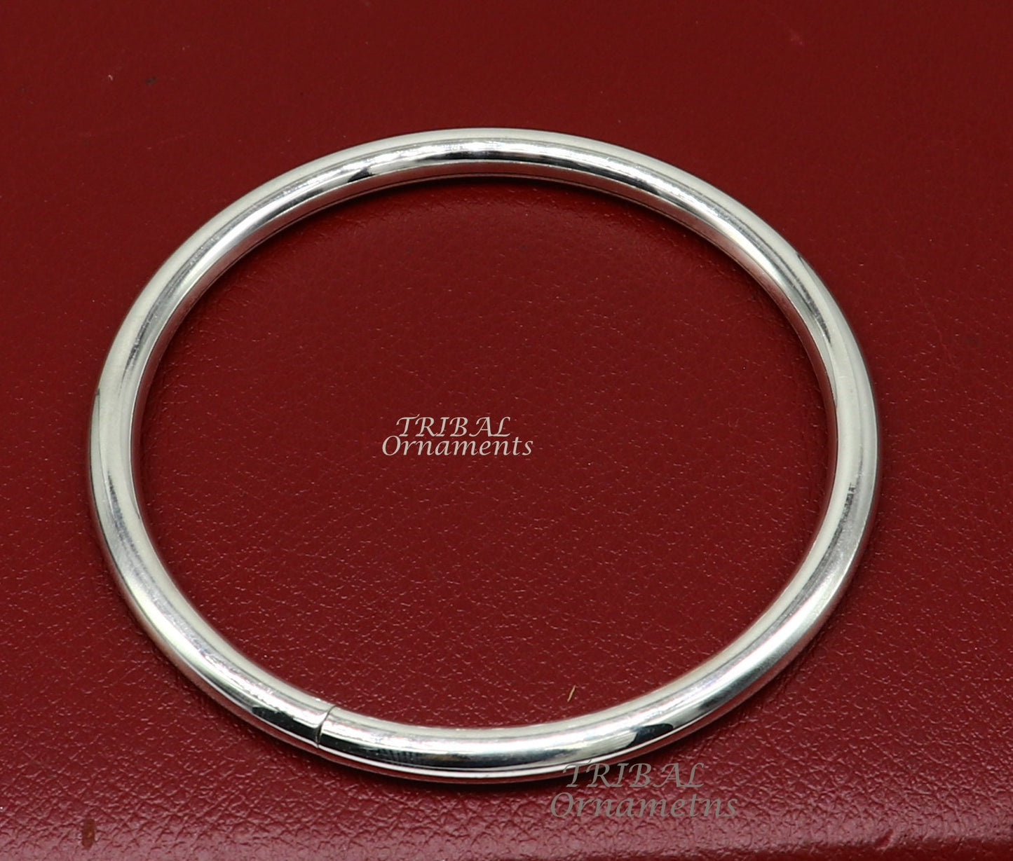 Shiny 925 sterling silver handmade bangle bracelet by Tribal Ornaments, plain and customized for unisex jewelry and personalized gifting.