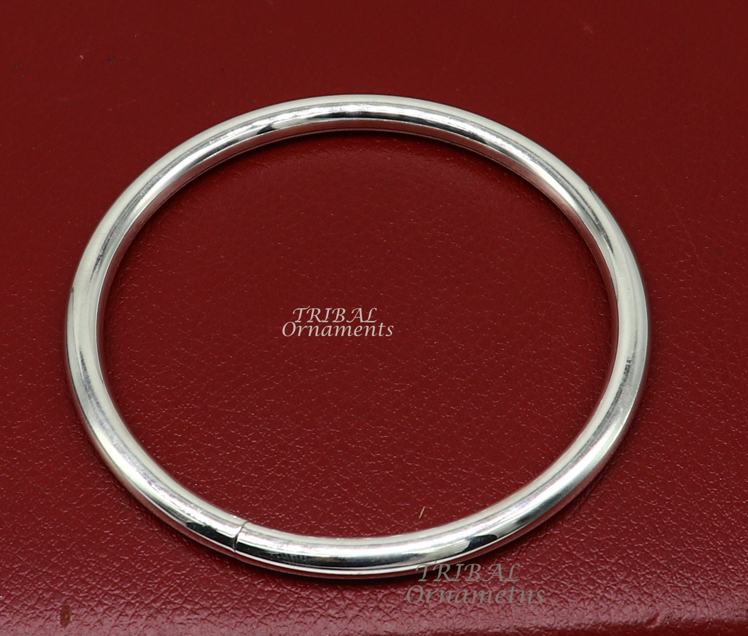 Shiny 925 sterling silver handmade bangle bracelet by Tribal Ornaments, plain and customized for unisex jewelry and personalized gifting.
