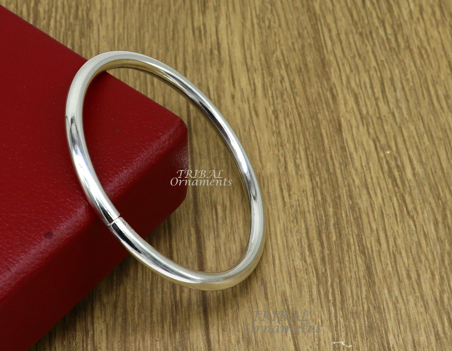 Sterling silver handmade bangle bracelet from Tribal Ornaments, shiny, plain, customizable unisex jewelry for personalized gifting