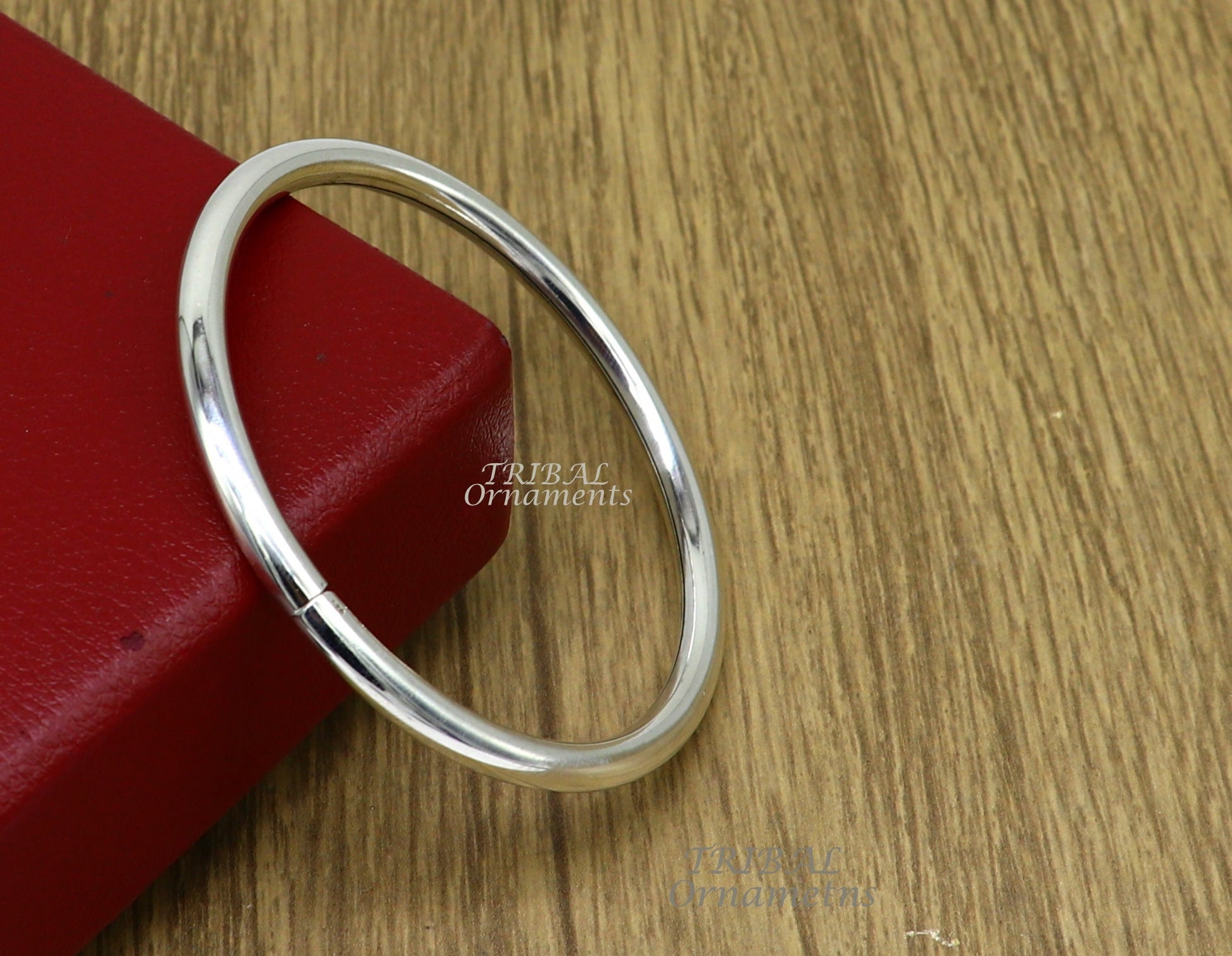 Sterling silver handmade bangle bracelet from Tribal Ornaments, shiny, plain, customizable unisex jewelry for personalized gifting