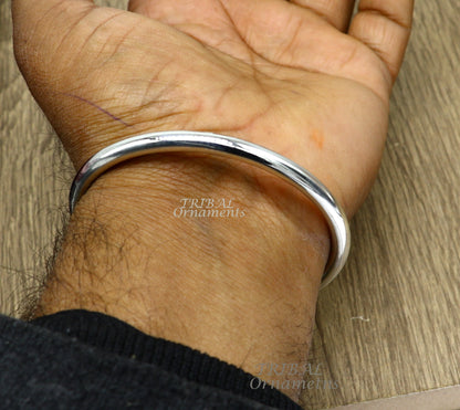 Handmade 925 sterling silver bangle bracelet with a shiny, plain finish, personalized unisex jewelry by Tribal Ornaments.