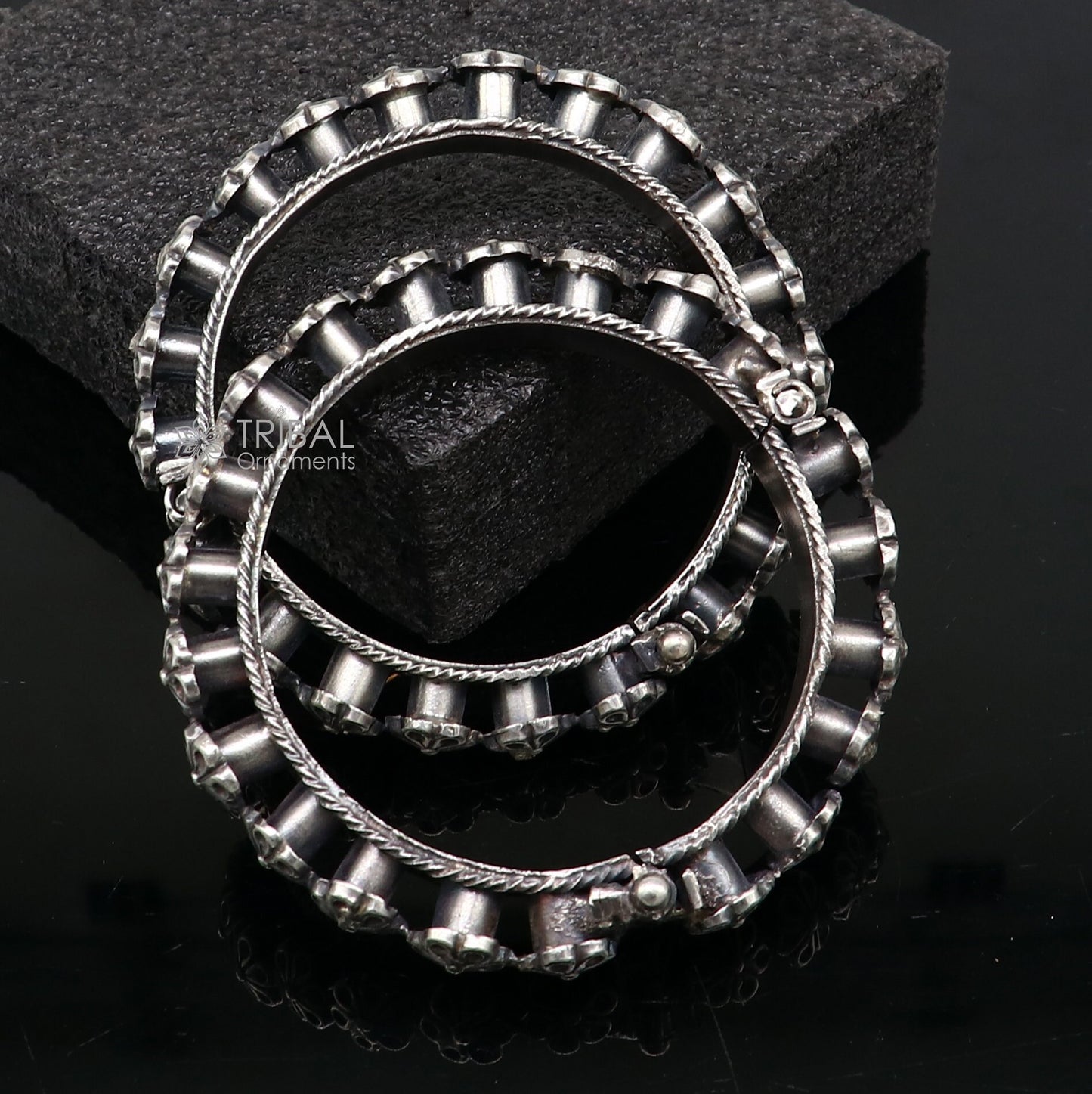 Sterling silver tribal floral bangle bracelet by TRIBAL ORNAMENTS, featuring intricate tribal cultural design for wedding jewelry.