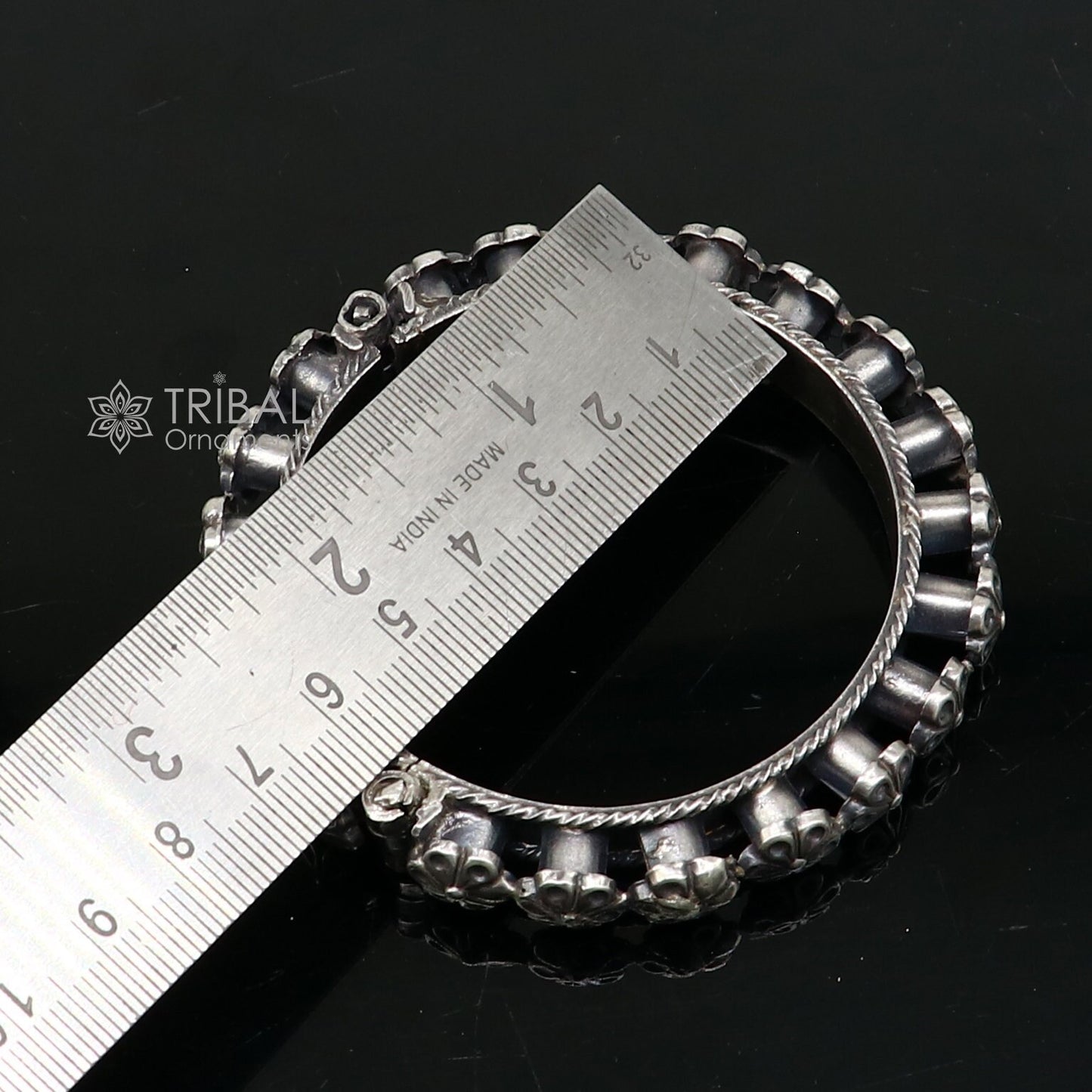 Sterling silver tribal floral bangle bracelet with intricate designs, perfect for bridal or wedding jewelry.