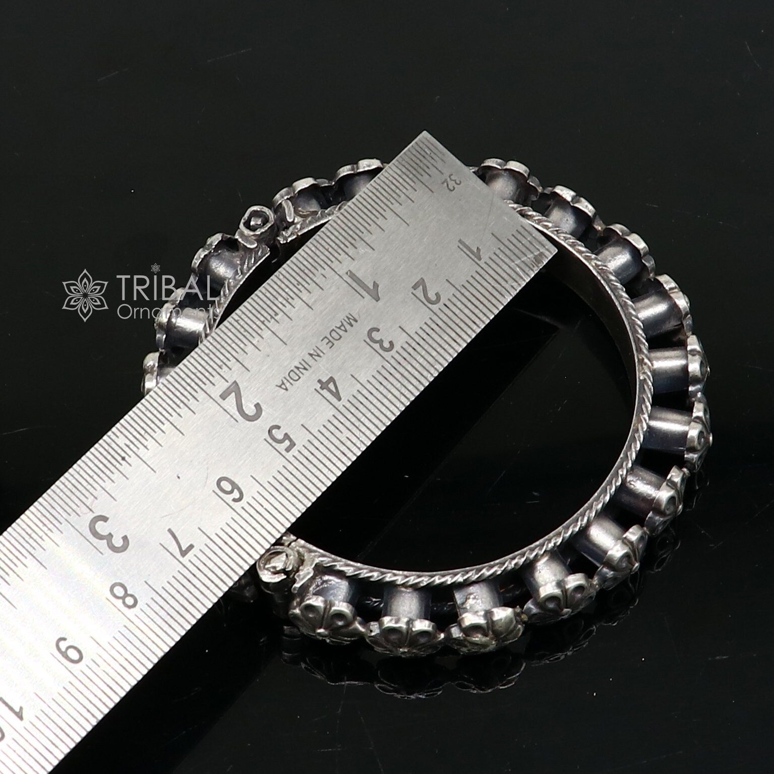Sterling silver tribal floral bangle bracelet with intricate designs, perfect for bridal or wedding jewelry.